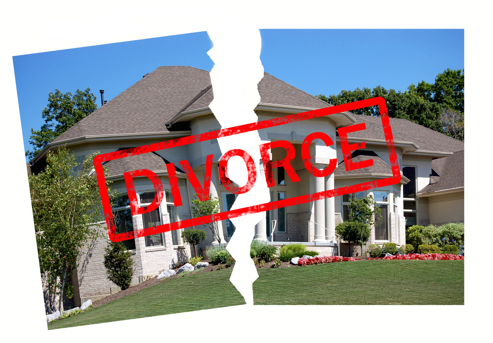 Torn image of a house with a 'divorce' stamp on it